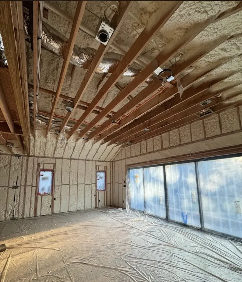 Interior walls and ceiling insulated with spray foam during new construction in Johnstown